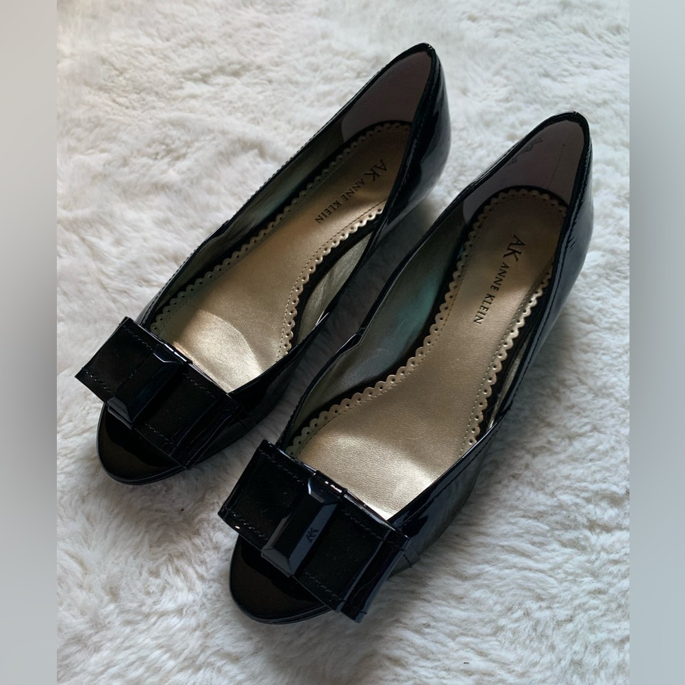 Anne Klein black patent leather wedge flats, worn once. Black bow with jewel.
